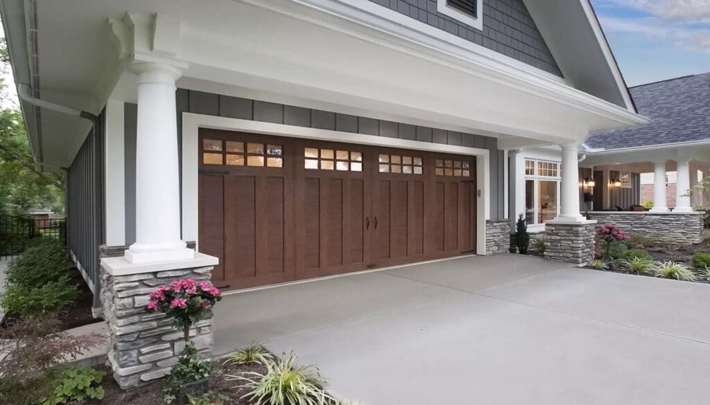 Home with Clopay Series Carriage House 4-Layer garage doors