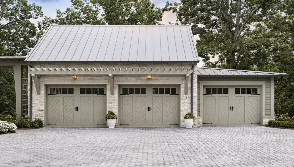 Home with Clopay Series Canyon Ridge: Chevron Carriage garage doors