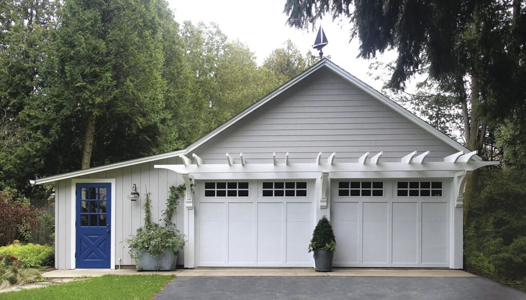Home with Clopay Grand Harbor garage doors